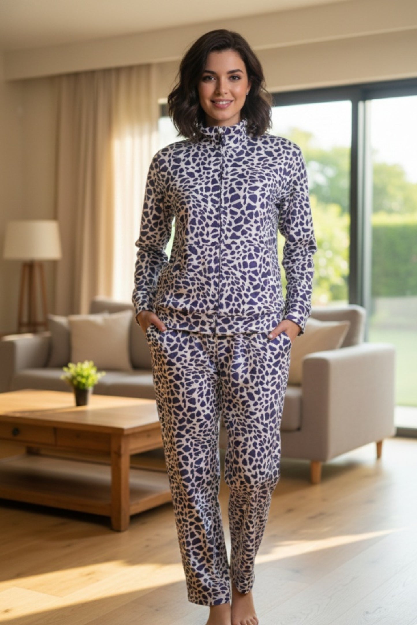 Woman wearing a leopard print outfit in a living room.